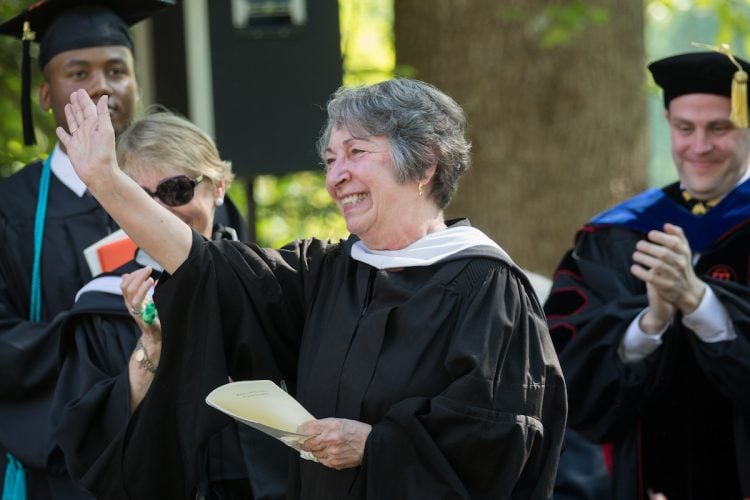 Paula Wallace, associate dean of the College, waves to the crowd at the 2018 Commencement ceremony. Paula Wallace, associate dean of the College, waves to the crowd at the 2018 Commencement ceremony.