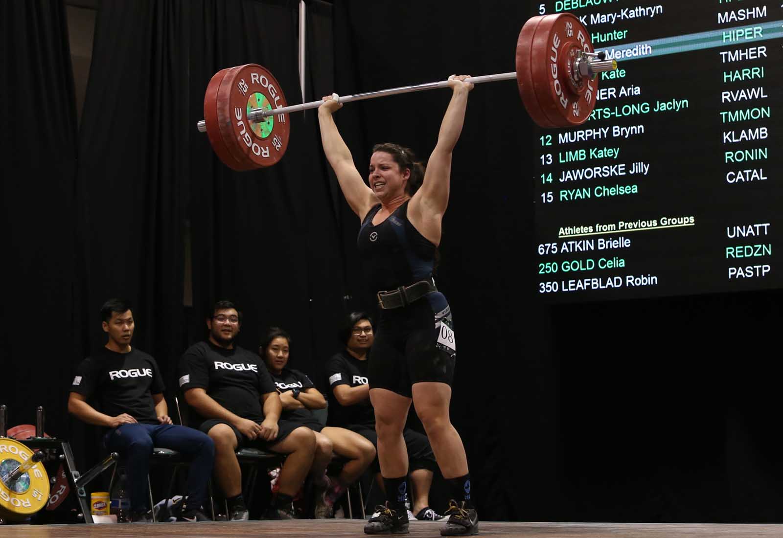 Meredith Alwine lifts 125 kg (275 lbs) during a clean and jerk at the 2017 American Open Finals in Anaheim, California, December 2017.