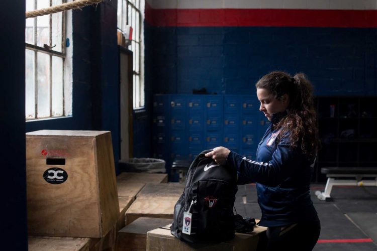 Meredith Alwine packs up after a training session.