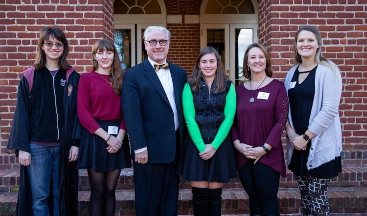 Mid-year graduates with President Bradley W. Bateman