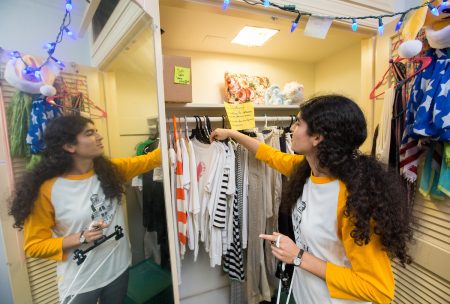 organizes the clothing selection in the Rummage Room.