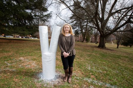 Rikki Carretta '19 next to the Odd Tree on front campus