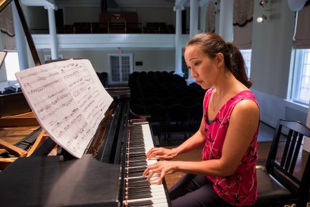 Emily Chua playing piano in Wimberly Recital Hall at Randolph