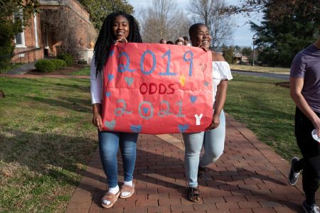 Sophomores show their support for their sister class by holding a banner