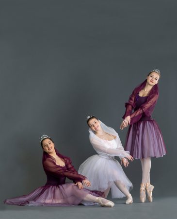 Three dancers posing for a photo