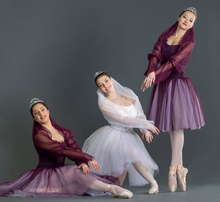 Three dancers posing for a photo Three dancers posing for a photo