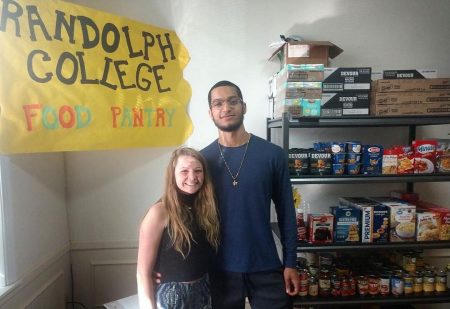 Student volunteers Madeline Owens '20 and Avery Payne '21 helped cut the ribbon for the official opening of the Randolph College Food Pantry on Wednesday.