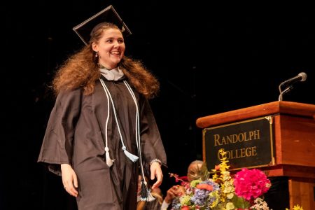 Mekenzie Schmitt walks on stage to accept the Maude Huff Fife Award for highest GPA in the Class of 2019