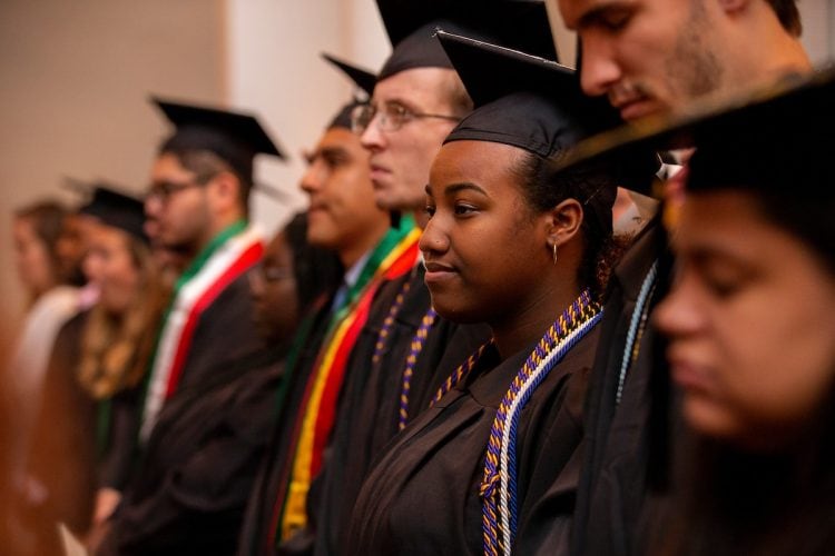 Graduates line up in Smith Hall Theatre