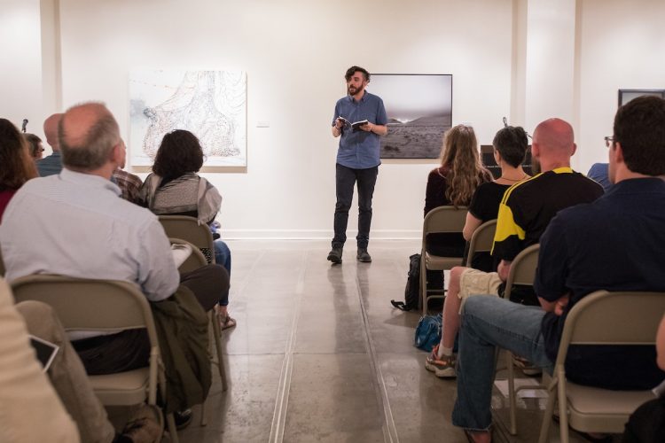 M.F.A. faculty member Kaveh Akbar shares his work during a public reading at the first residency last summer