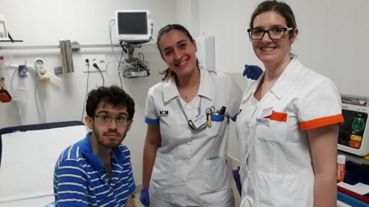 Isaiah Freedman (left) with two Rosaleda Hospital employees