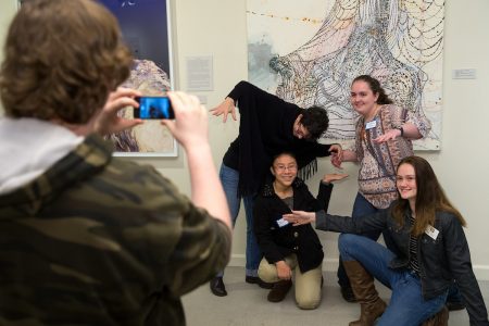 Students take photos and selfies with art in the Maier as part of a Science + Art Saturdays activity