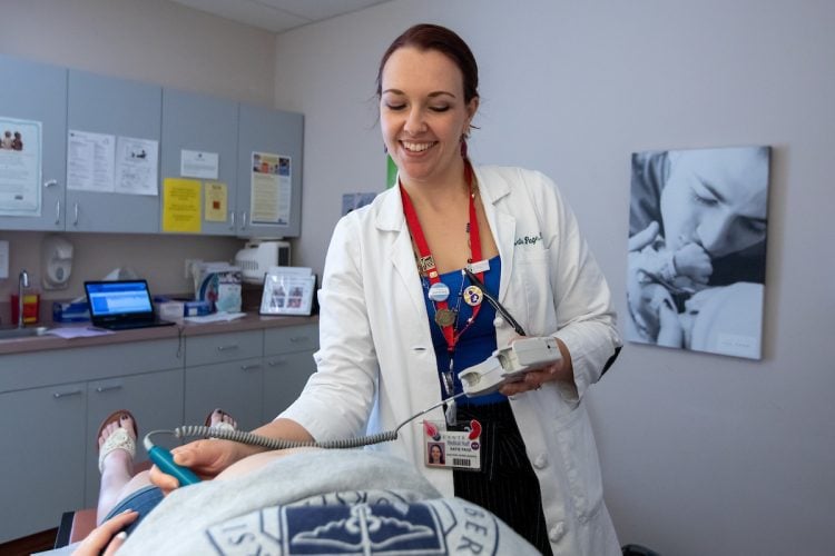 Katie Stewart Page examines a patient at the Centra Medical Group Women's Center