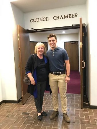 Anthony Fonnesu and professor Francoise Watts at Lynchburg City Hall after Fonnesu was named ambassador to Rueil-Malmaison