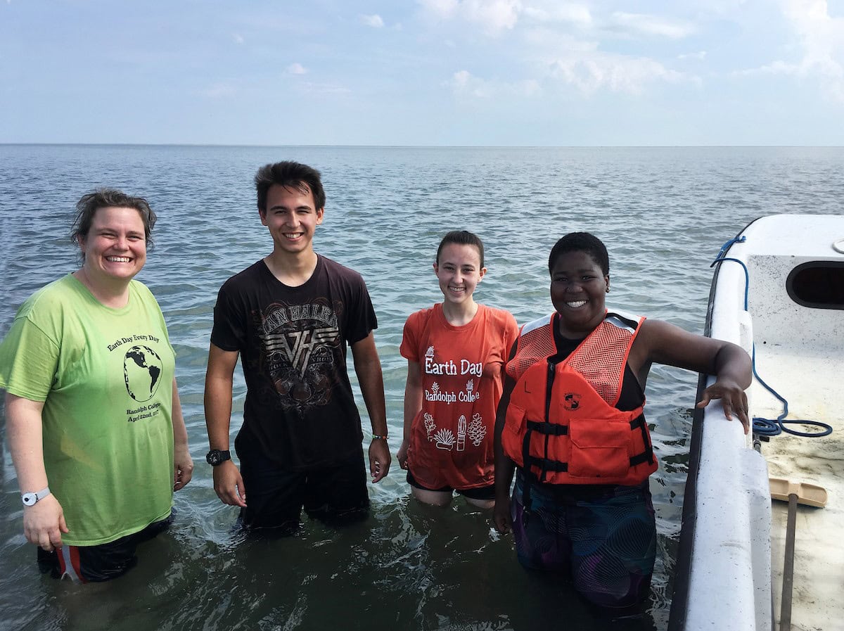 (From left) professor Sarah Sojka, Alex Kulvivat, Paige Edwards, and Jdody Misidor in the water along the eastern shore of Virginia.