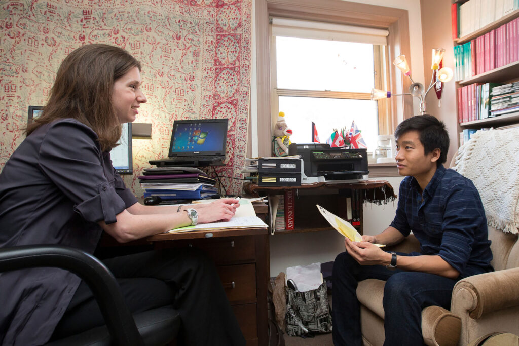 Professor Liz Perry advising a student