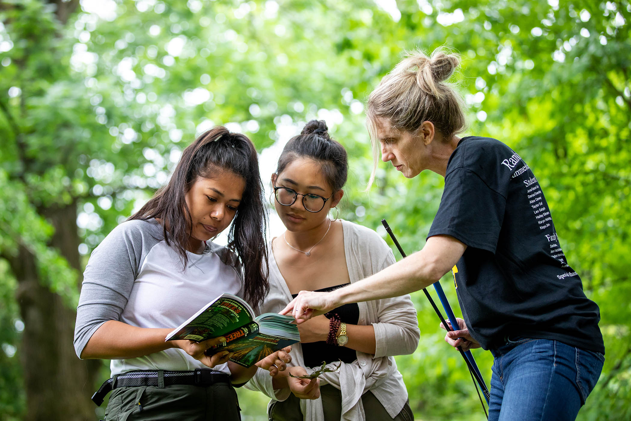 Environmental science professor Karin Warren helps summer research students conduct a forest inventory.