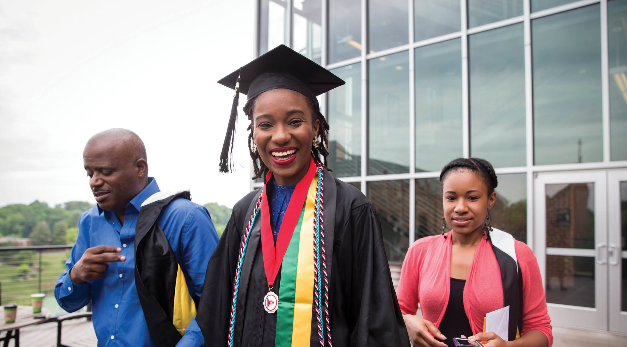Graduating student with her parents.