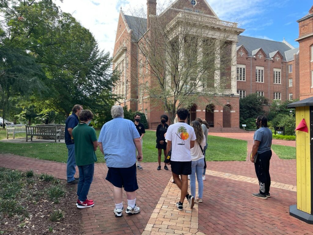 students and their families gather near Smith Hall and the Sundial during a campus event