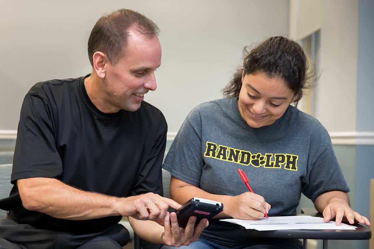 Professor Jeff Heinfeldt works with a student.