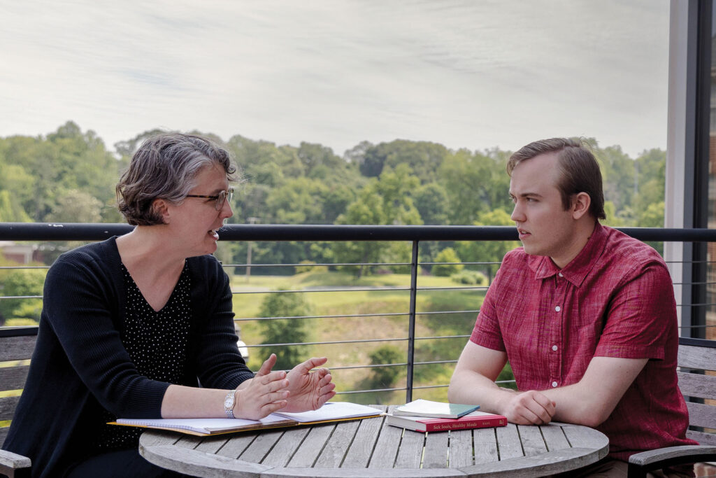 Professor Kaija Mortensen advises a student at Randolph College