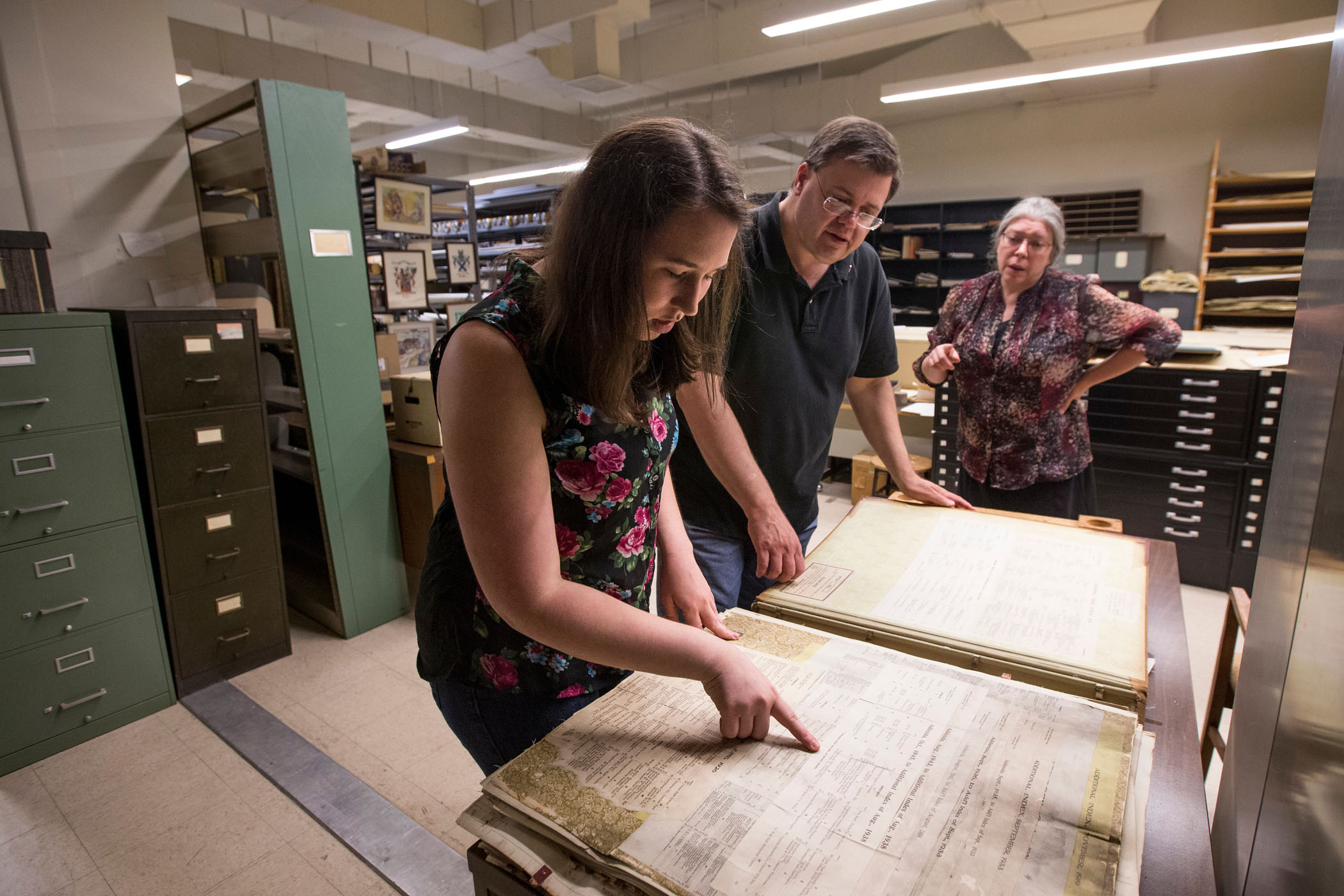 Samantha Strickler ’17 and History Professor Gerry Sherayko and look up property records from the early 1900's in the Jones Memorial Library.