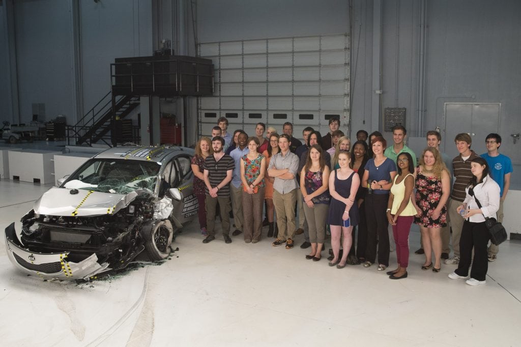 Photo of students with car