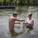 Allison Brooks '18 and Rob Campbell '13 collect soil samples by hand while Melissa Pasierb '17 and River Keeper Pat Calvert test other sites from a motorboat.