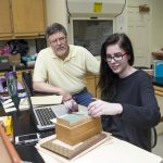 Professor of Psychology Rick Barnes and Sarah Ballard-Abbott '16 look through historic psychological tests in the College's psychology lab.