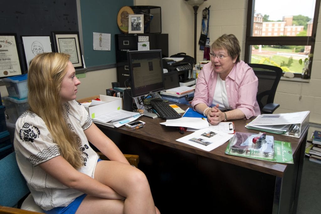 Addie Moore '17 meets with Cheryl Lindeman to discuss the lesson plan she is developing to help children understand the environmental impact of the 2014 Lynchburg train derailment.