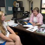 Addie Moore '17 meets with Cheryl Lindeman to discuss the lesson plan she is developing to help children understand the environmental impact of the 2014 Lynchburg train derailment.