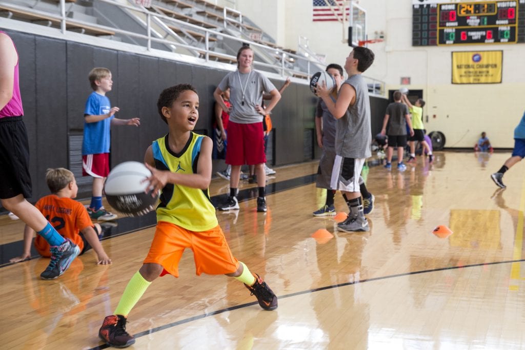 A camper prepares to pass the ball at Randolph's Skill Builder Hoop Camp 2015.