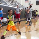 A camper prepares to pass the ball at Randolph's Skill Builder Hoop Camp 2015.