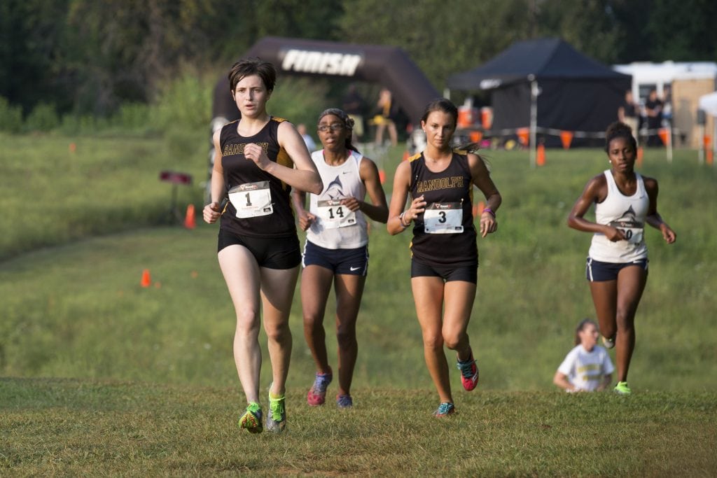 Sophia Dill (#1) and Dani Hlll (#3) crest the hill.