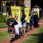 Bagpiper leads the senior procession