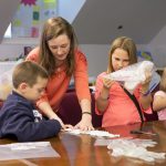 Grace Cummins '16 teaches TAG students about polymers.