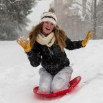 Sledding on front campus during Snow Day 2016.