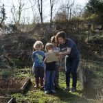 Instructor Shanna Jackson helps RCNS students find their gardens using a map.