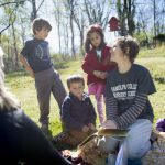 Teacher Shanna Jackson reads a book about praying mantises to the students of Randolph College Nursery School on Wednesday while in the organic garden on campus at Randolph College. Photo by Jill Nance