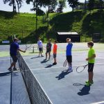 Kids receive instruction at Randolph College tennis camp.