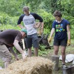 Jessy Spencer ’18 oversees the construction of a straw bale bench made at a workshop last week.