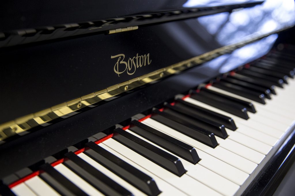 A close-up of one of the new Boston upright pianos