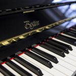 A close-up of one of the new Boston upright pianos