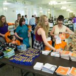 Volunteers assemble after-care kits in Smith Banquet Hall