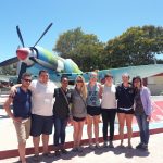 Randolph students in front of a classic Cuban airplane.