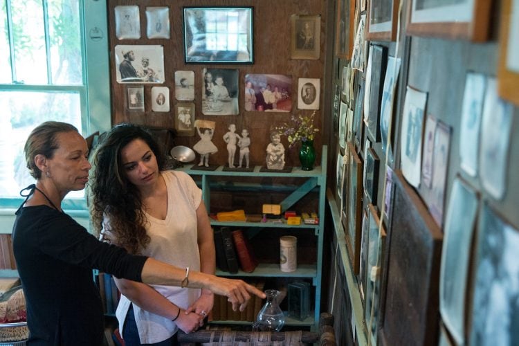 Shaun Spencer-Hester shows Nour Elkhamra '17 a wall of photos kept by her grandmother, Anne Spencer. Shaun Spencer-Hester shows Nour Elkhamra '17 a wall of photos kept by her grandmother, Anne Spencer.