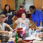 Igor Ngabo '18 assists teachers in an activity during Randolph's 2017 teaching institute, 