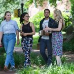 (From left) Sustainability coordinator Sara Woodward '16, Shataaxi Joshi '19, Arnav Upadhyay '19, and the Herzog Family Chair of Environmental Studies Karin Warren discuss their project while walking on campus.