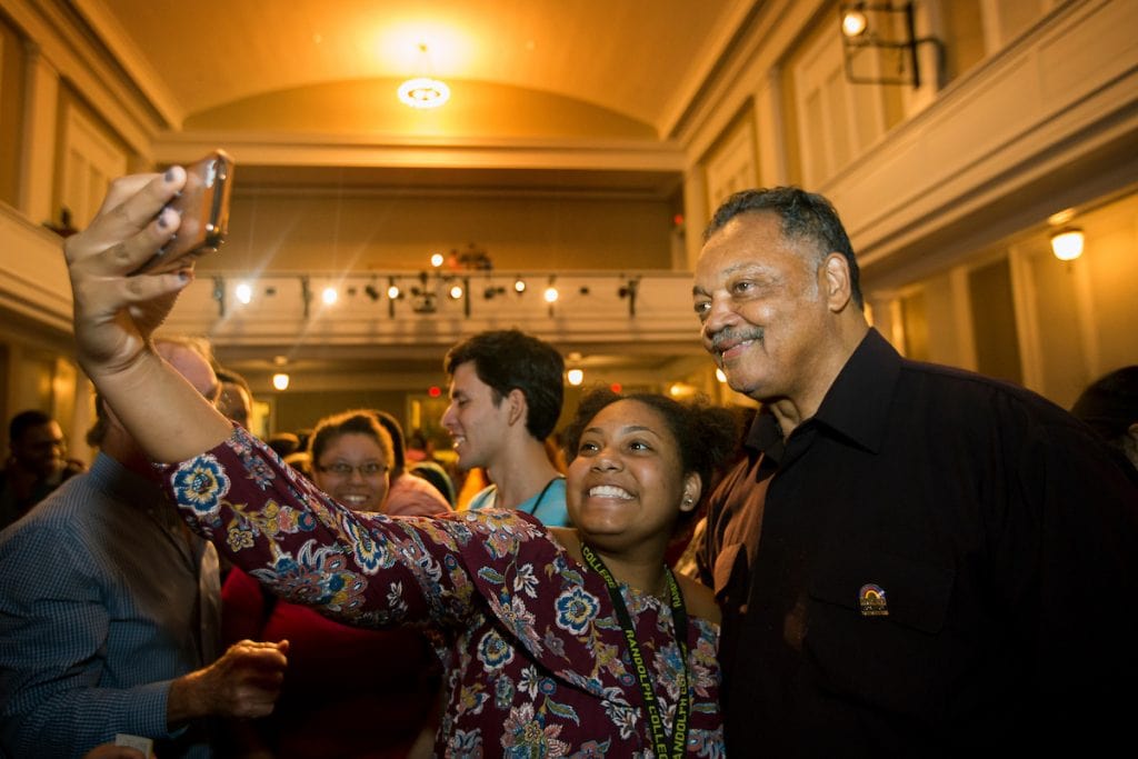 Students pose for photos with Rev. Jesse Jackson