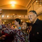 Students pose for photos with Rev. Jesse Jackson